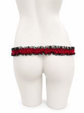 Load image into Gallery viewer, Black red lace support strap shown from the rear on a display mannequin