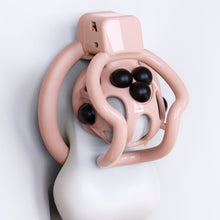 Lade das Bild in den Galerie-Viewer, Pink spider-frame chastity cage showing removable silicone stud placement

